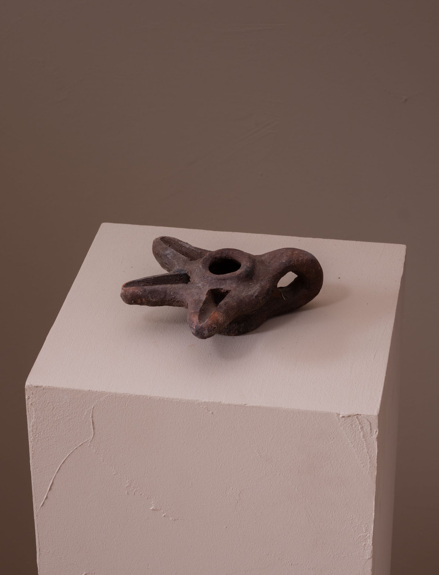 Terracotta oil lamp with three spouts