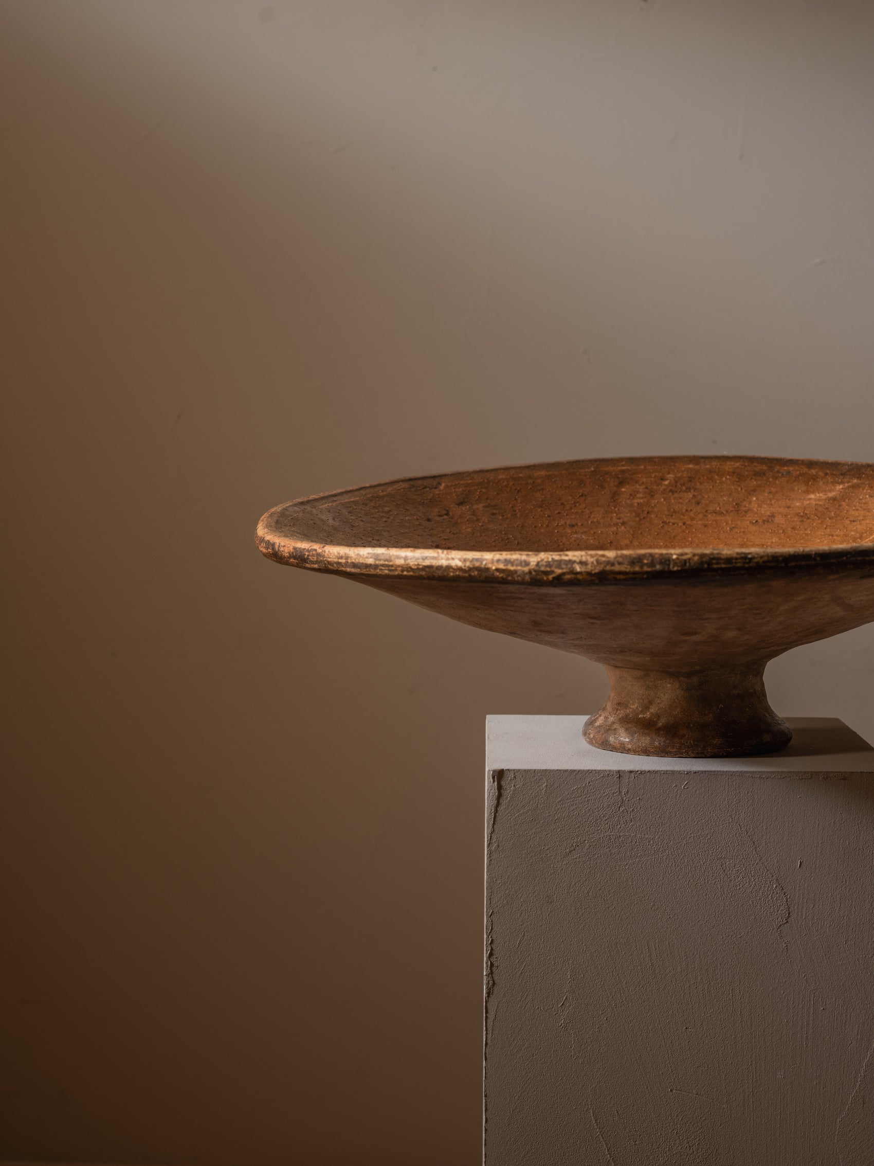 Large terracotta serving dish with foot