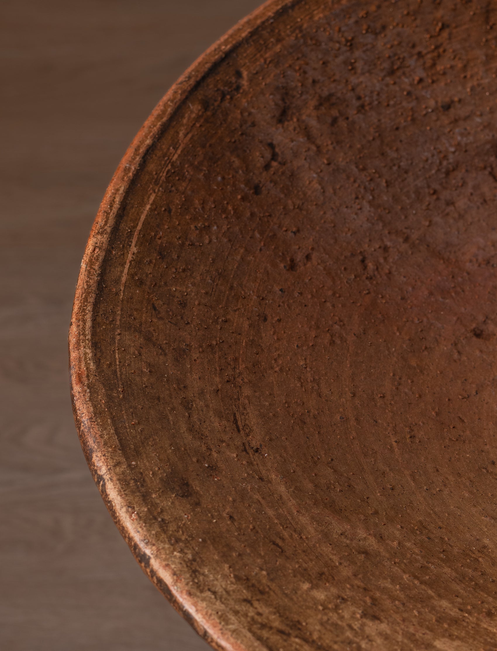 Large terracotta serving dish with foot