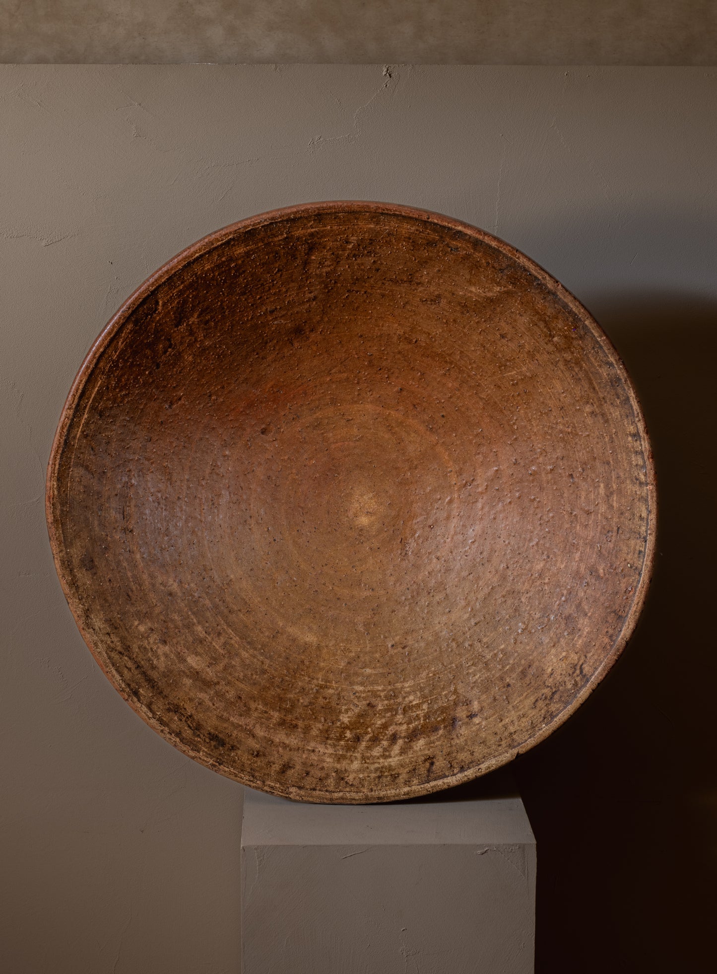 Large terracotta serving dish with foot
