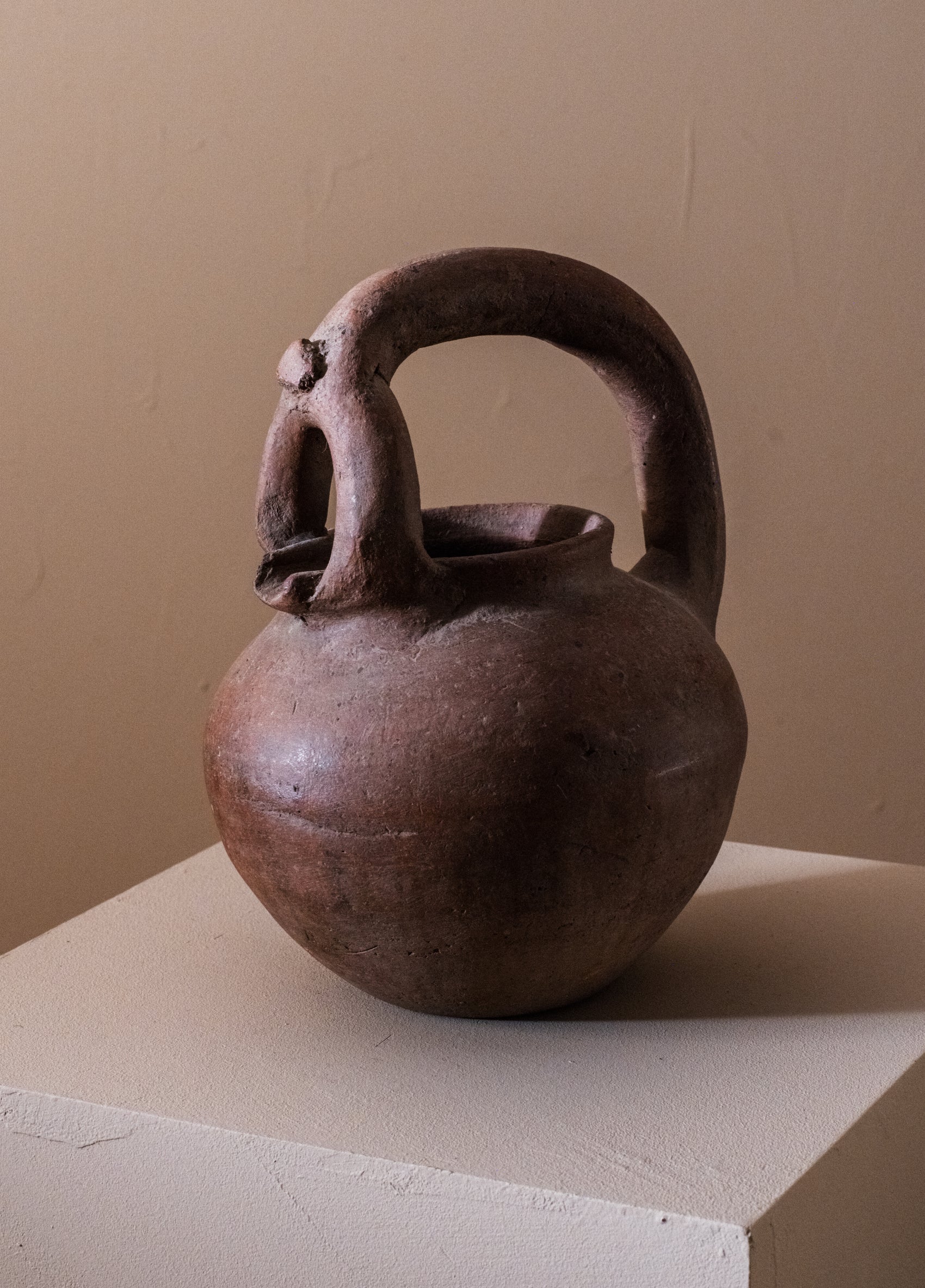 Unglazed spouted vessel