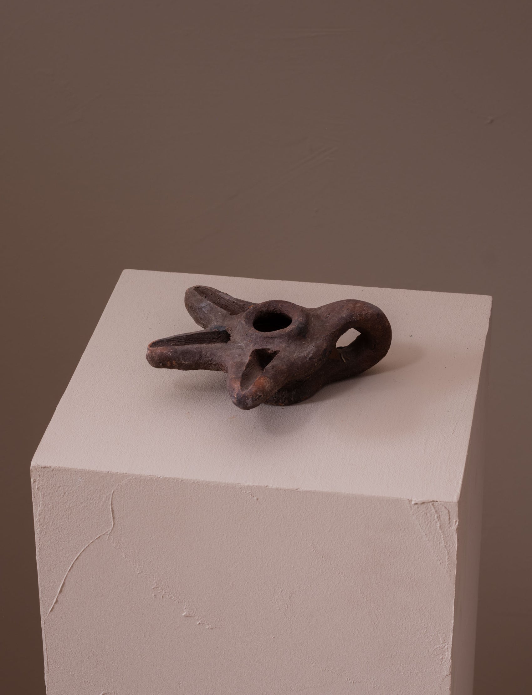 Terracotta oil lamp with three spouts