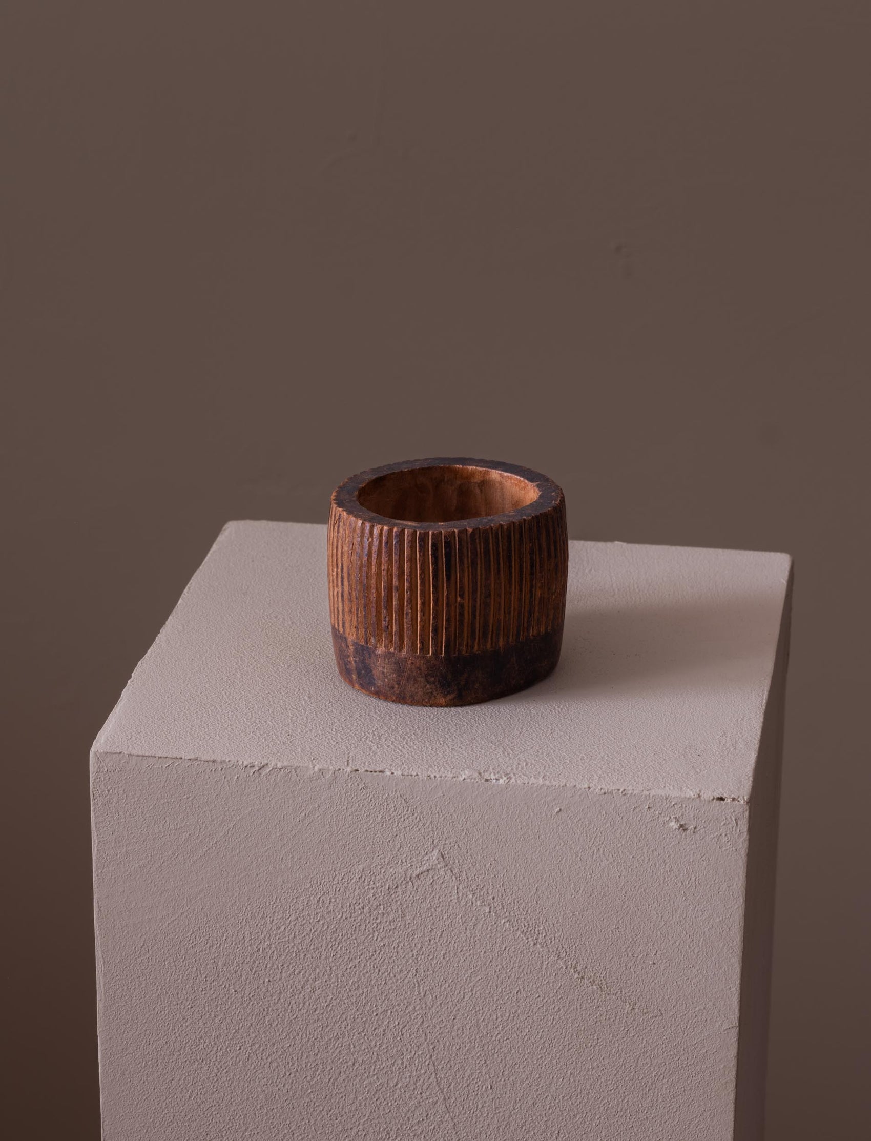 Small fluted wooden cup carved by hand