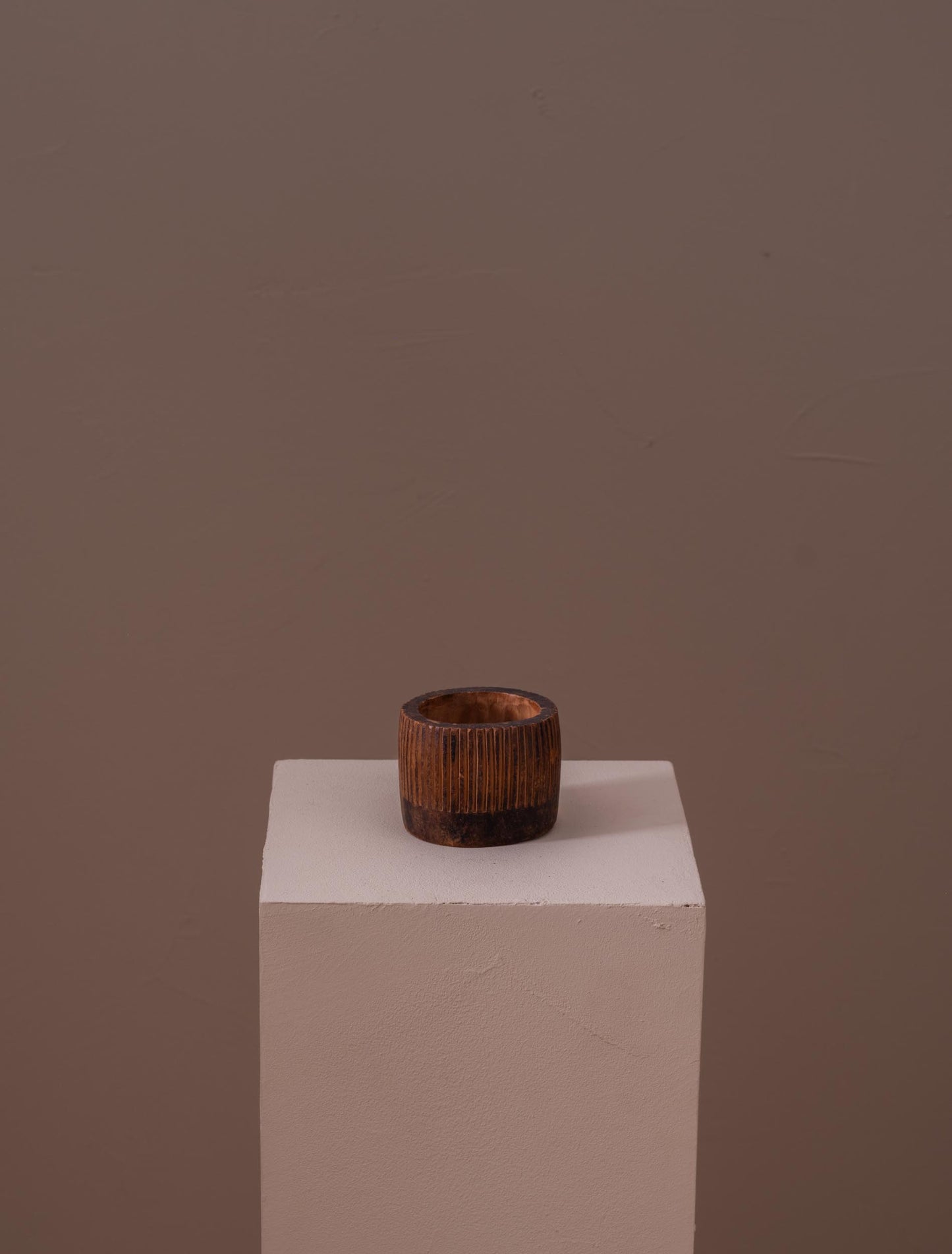 Small fluted wooden cup carved by hand