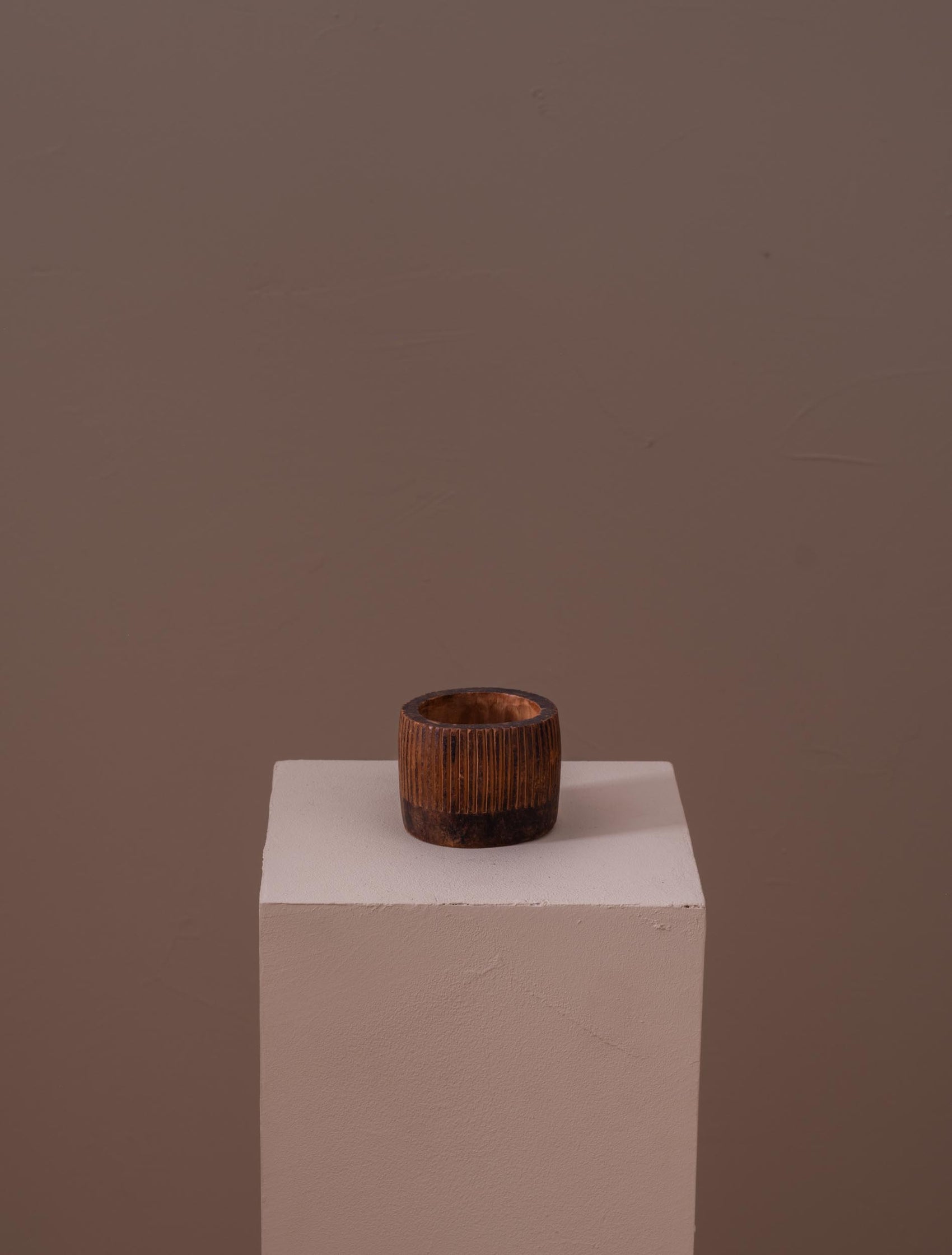 Small fluted wooden cup carved by hand